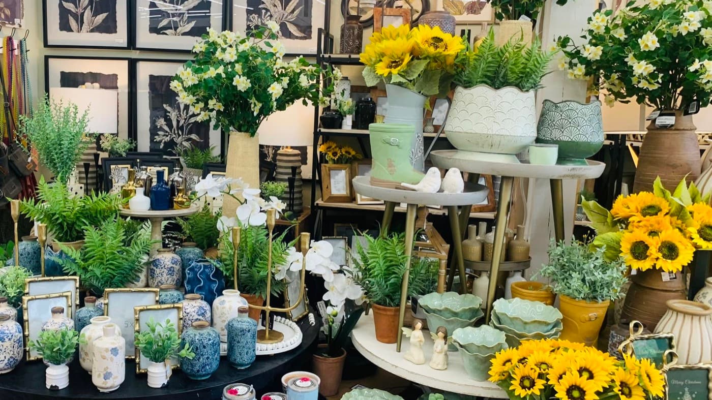A home decor boutique with sunflowers and pottery