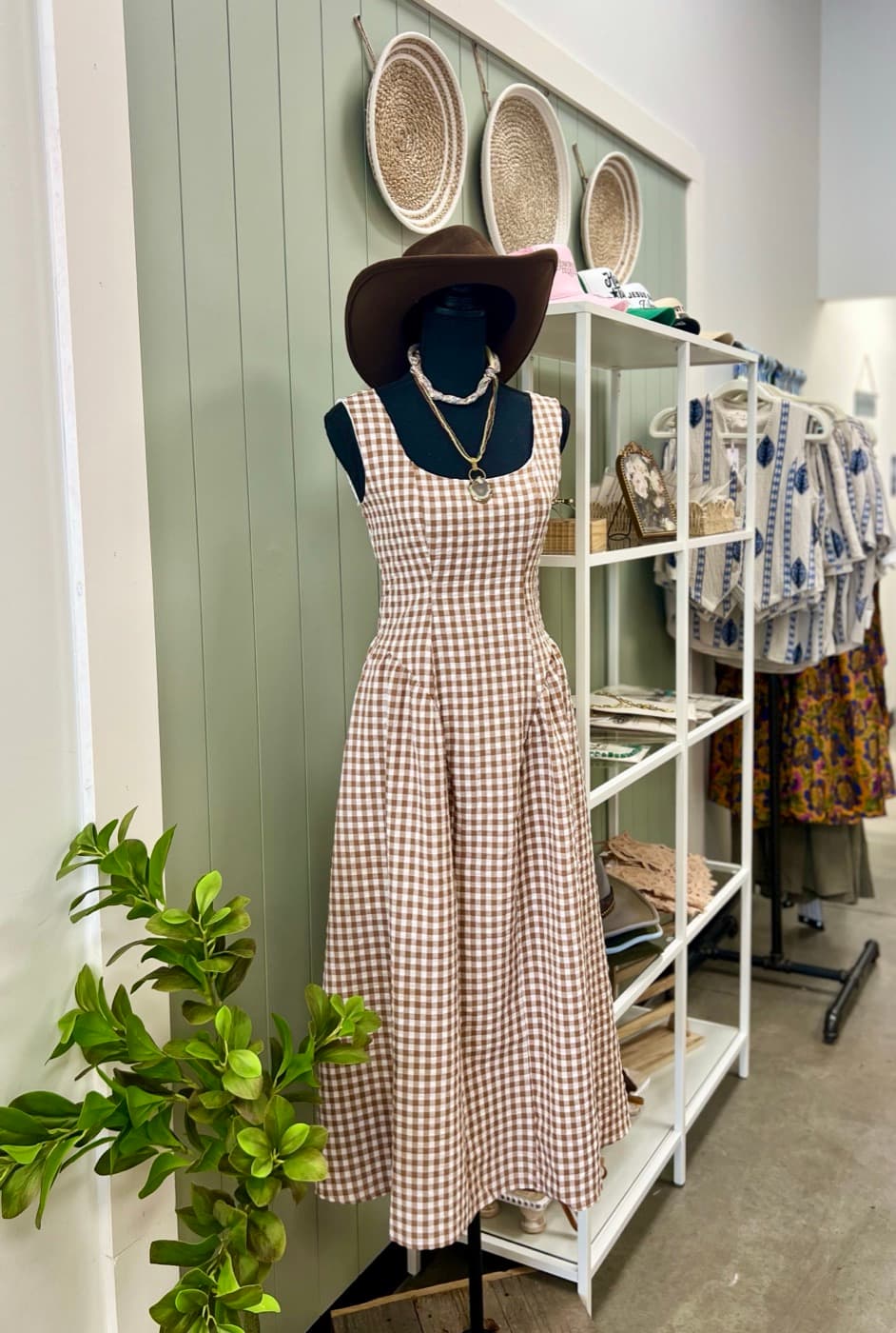 A gingham dress styled on a mannequin