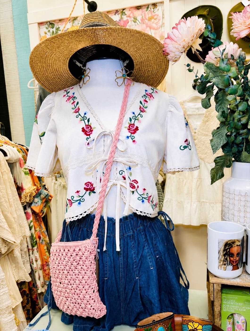 An embroidered outfit styled on a mannequin